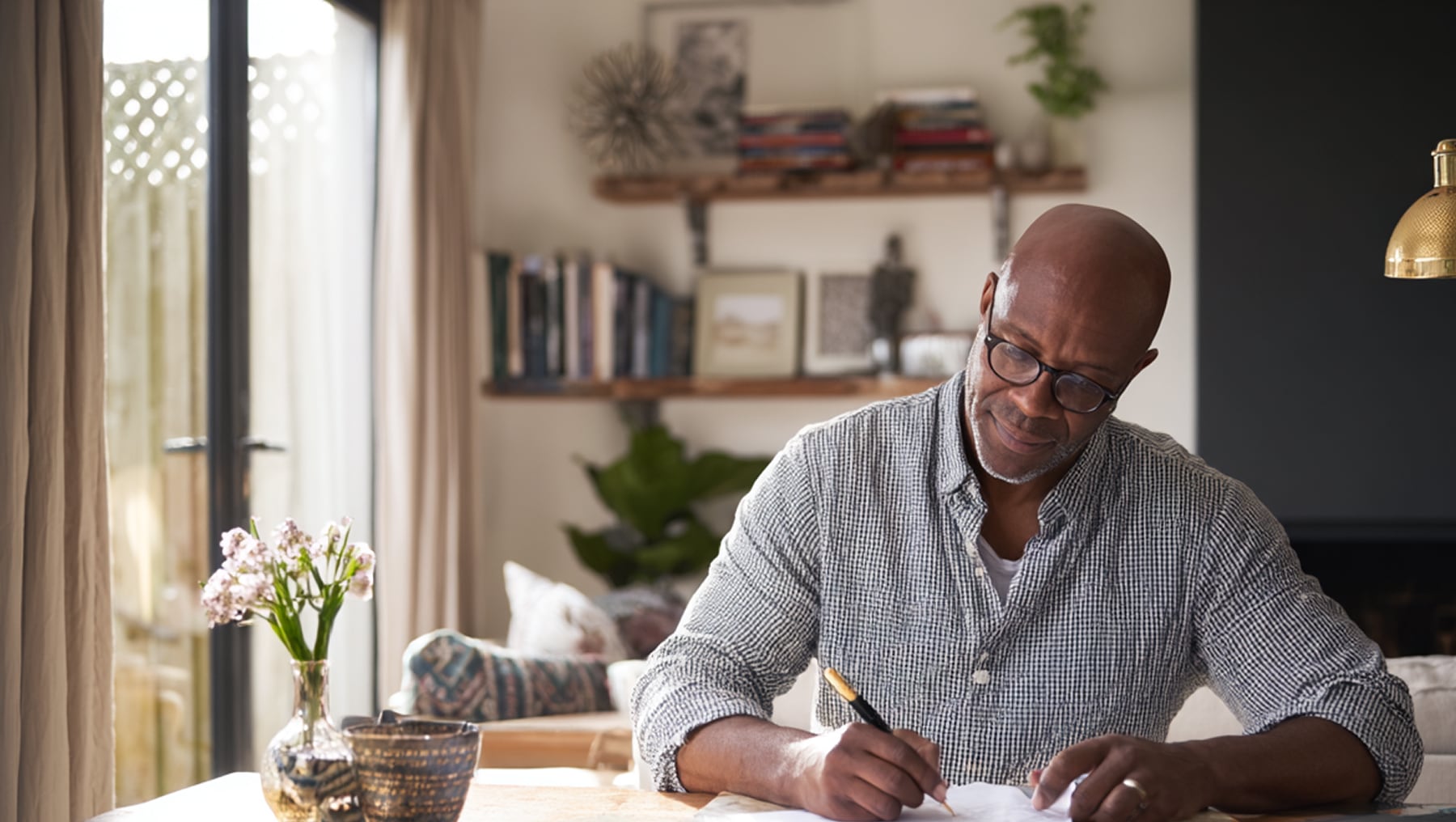 Client reviewing financial documents at home