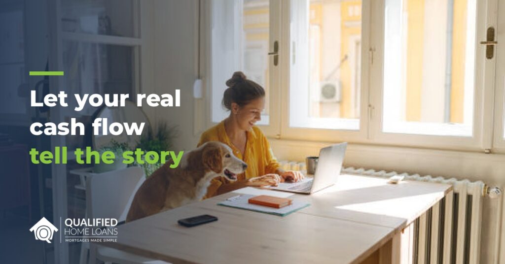 Self-employed woman working on a laptop at home beside her dog, with the headline Let your real cash flow tell the story